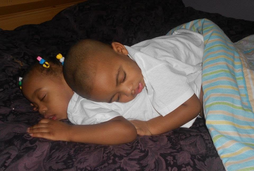 Young Jelani and Azaria resting together