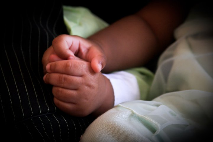 Hands held together in a moment of connection