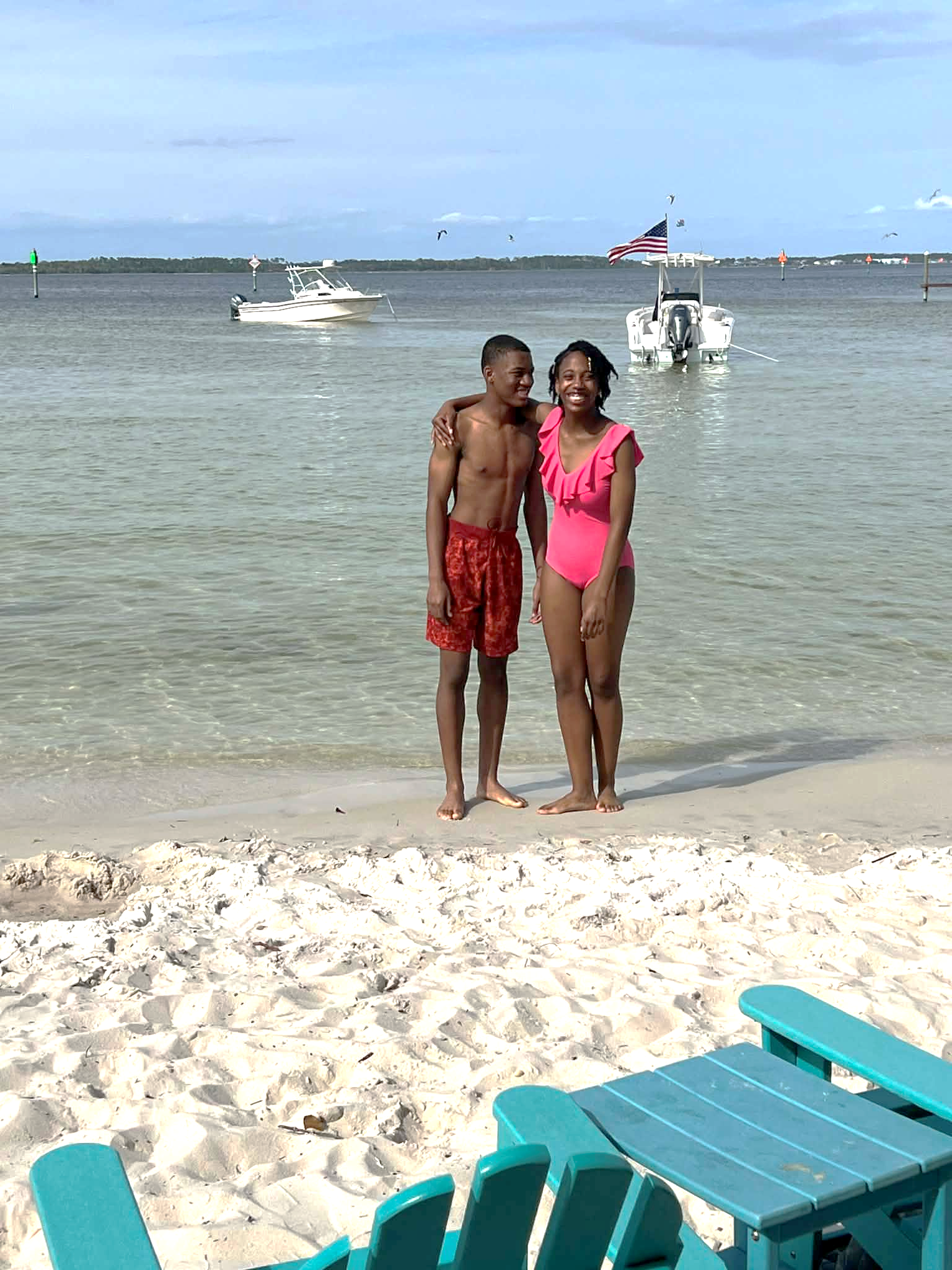 Jelani and Azaria standing together on a beach