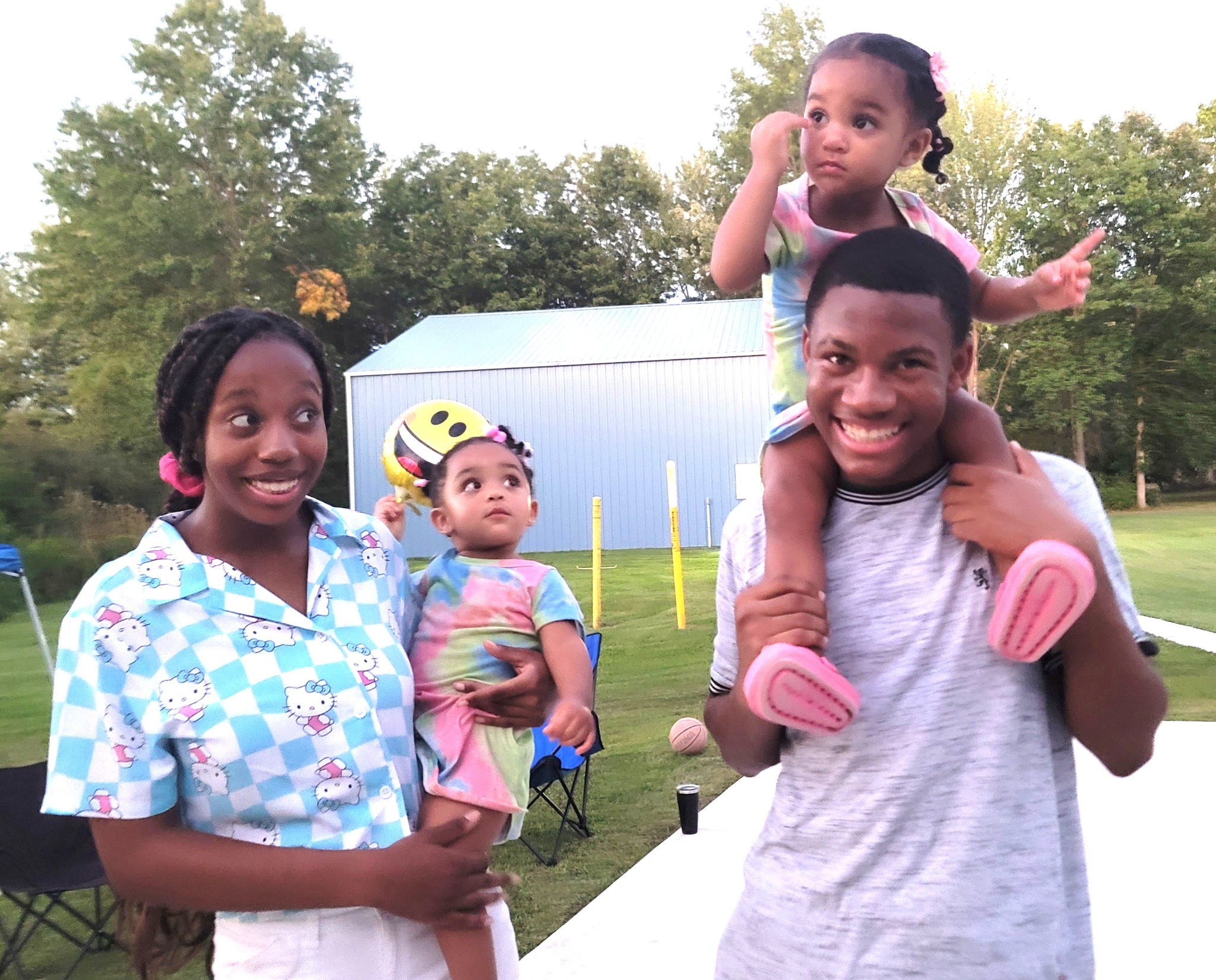 Jelani, Azaria, Eden, and Everlee together outdoors